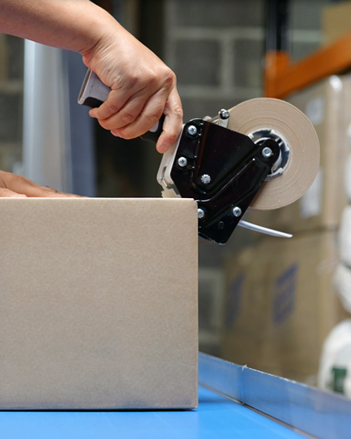 Eco-friendly packaging. Cardboard box and paper tape.